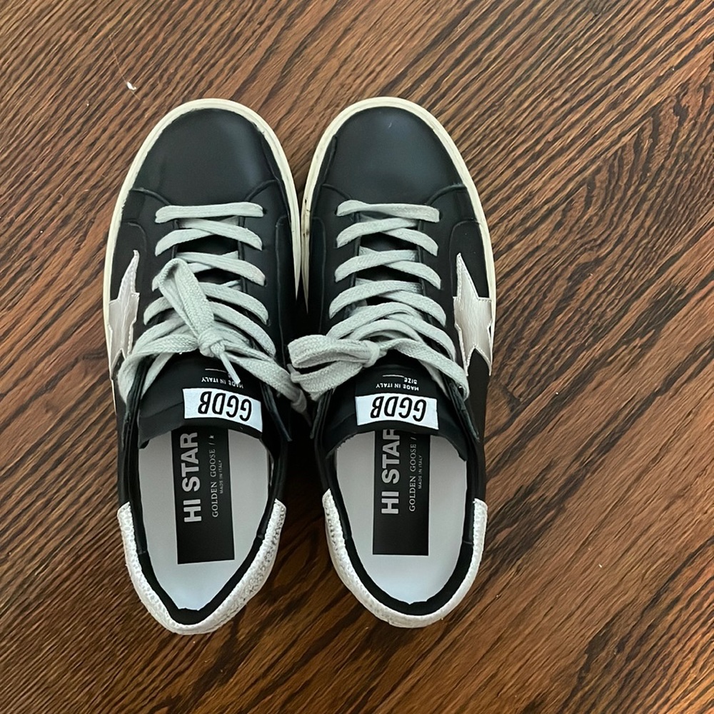 Golden Goose hi star sneaker in black.